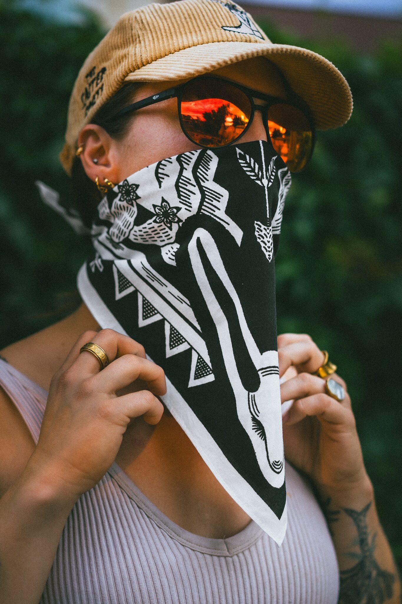The Salted Roots bandana styled as a neck scarf